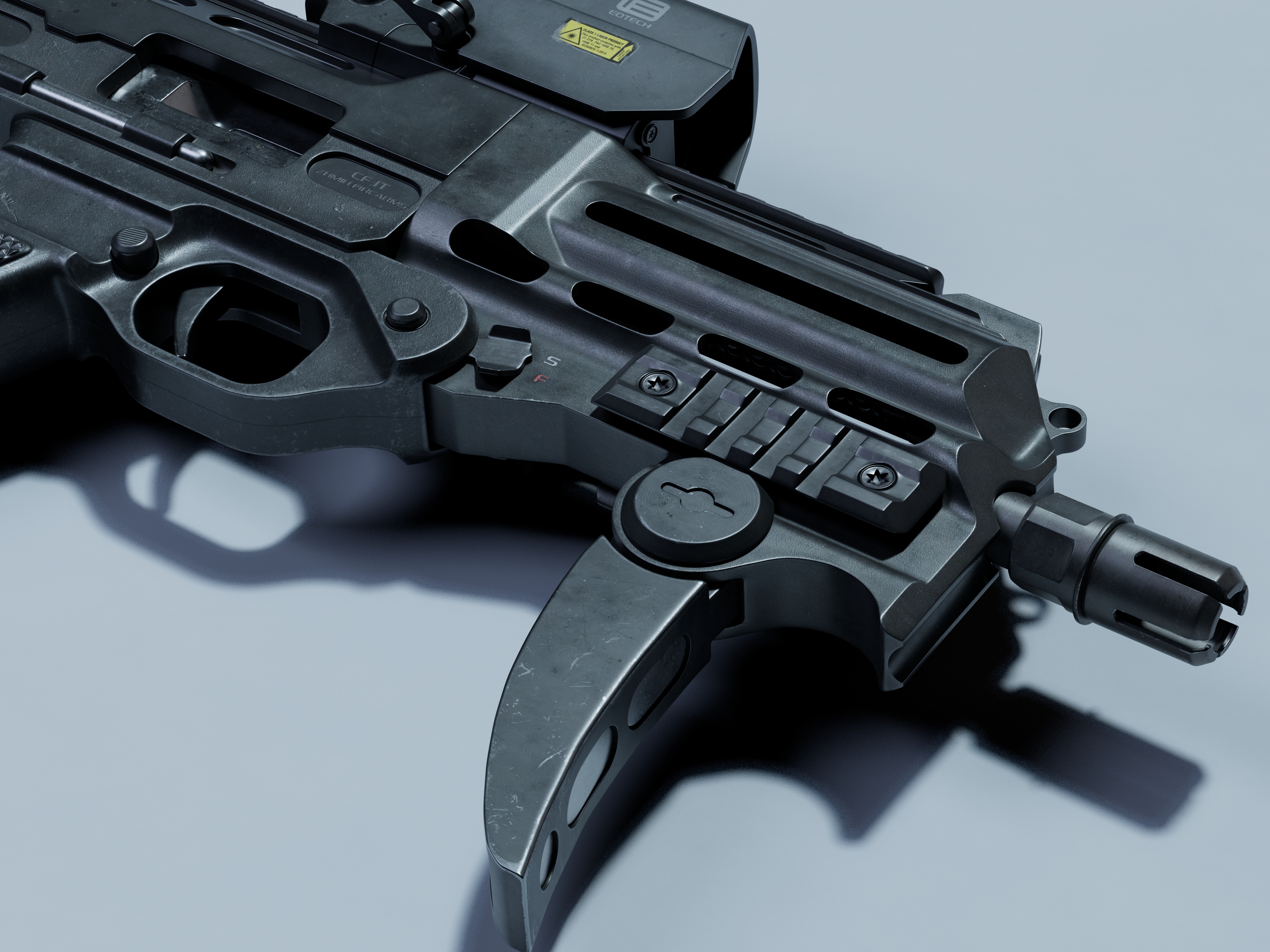 冲锋枪前端护木与枪口特写,导轨螺丝与消焰器细节